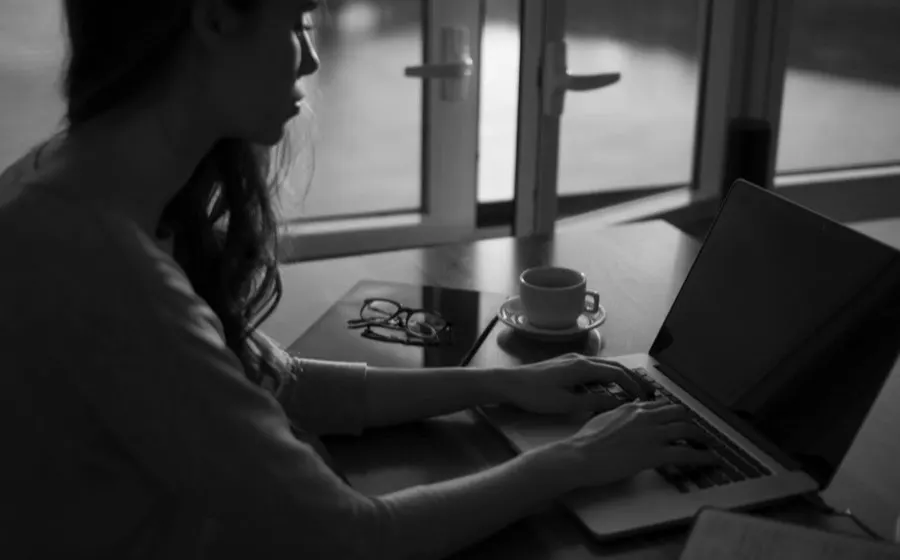 Person working focused on a laptop