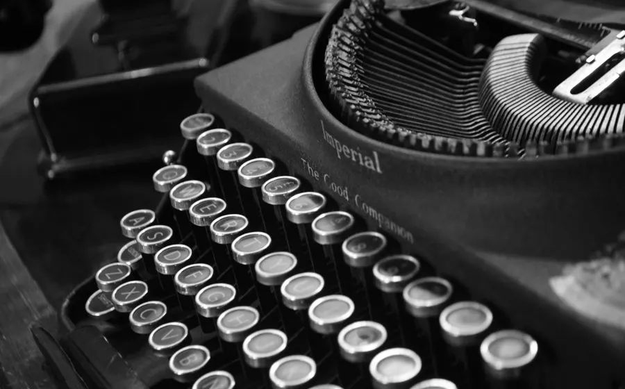 An old typewriter, its keys and type bars up close